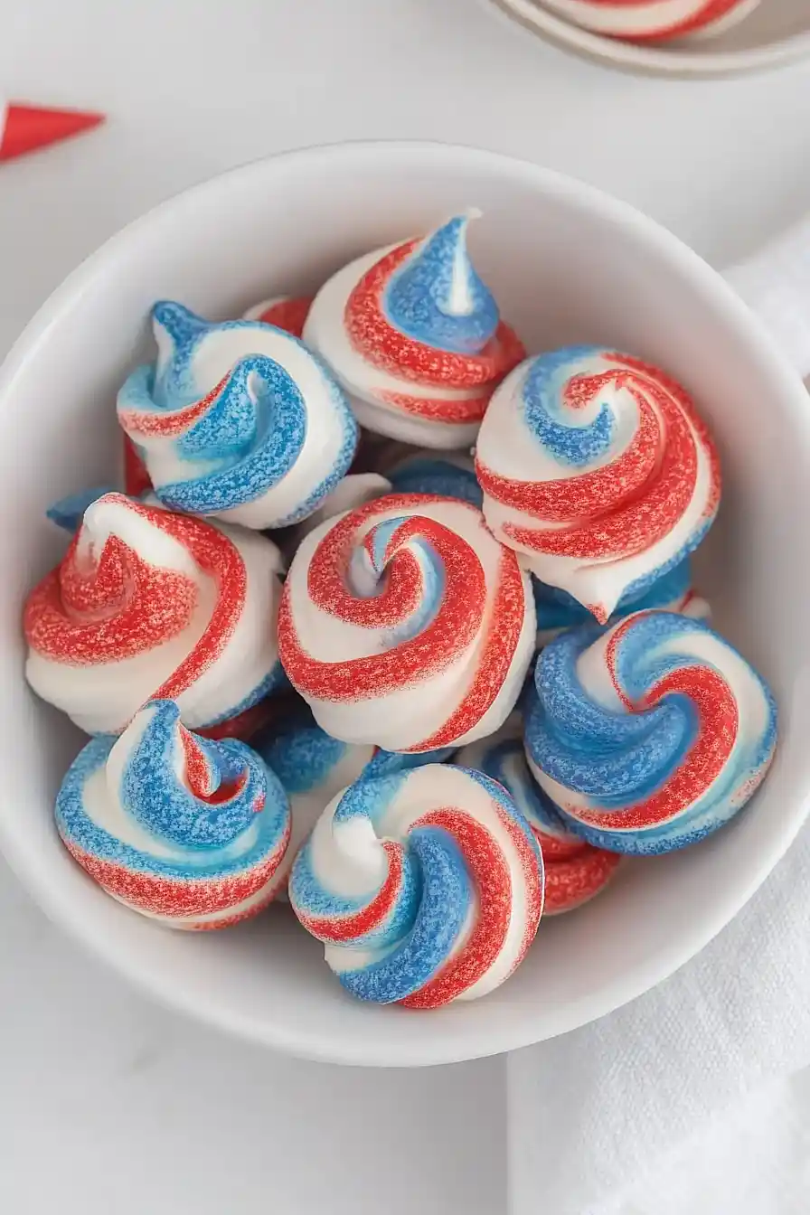 Red, white, and blue meringue cookies
